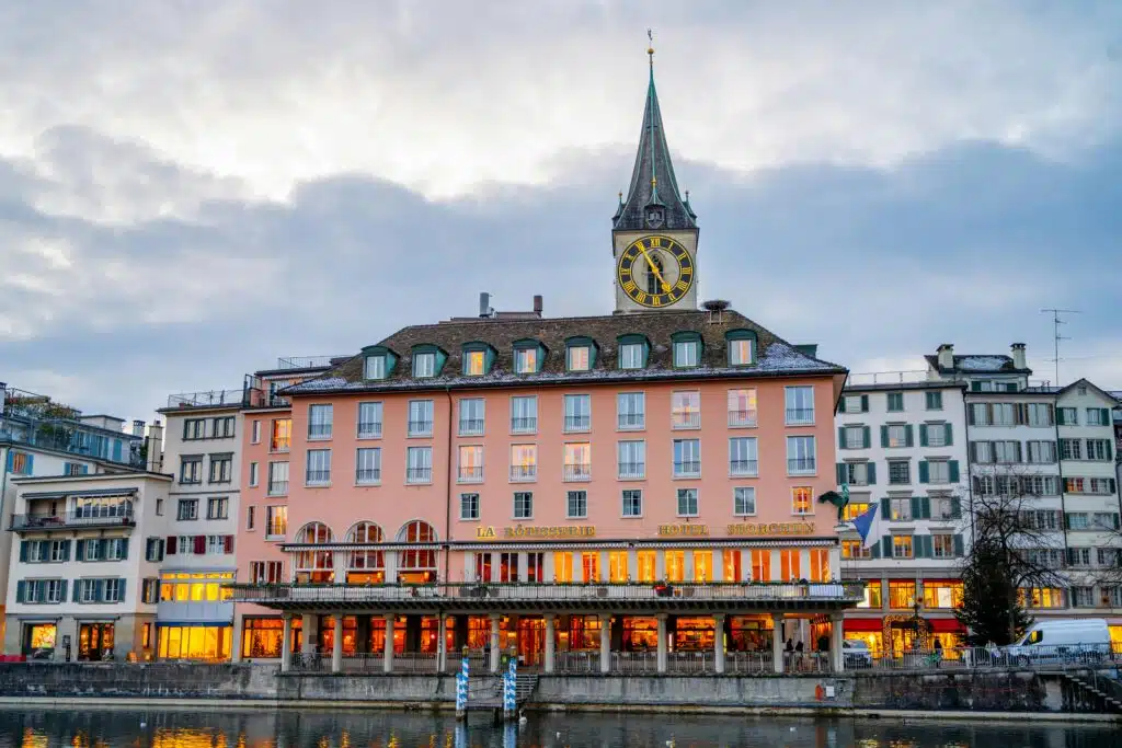 Charming Zurich architecture on display during twilight along the waterfront.